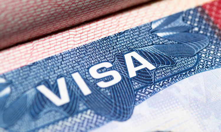Close-up of a United States visa stamp printed on a passport page.
